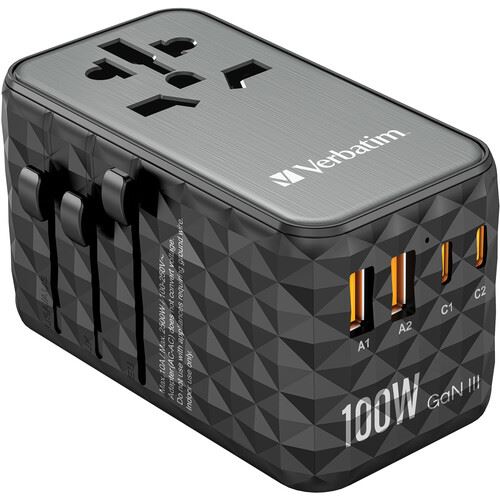 A photo of a black plastic cube. The cube has sockets for different plugs and for charging cables.